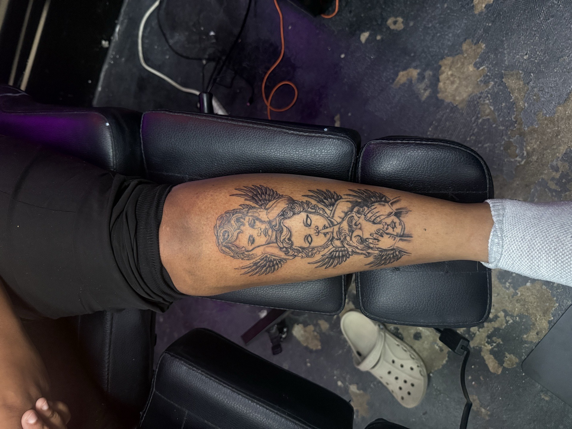 Fine Line + Black-work cherubs tattoo on Calf by AmenInkLLC on TattMe