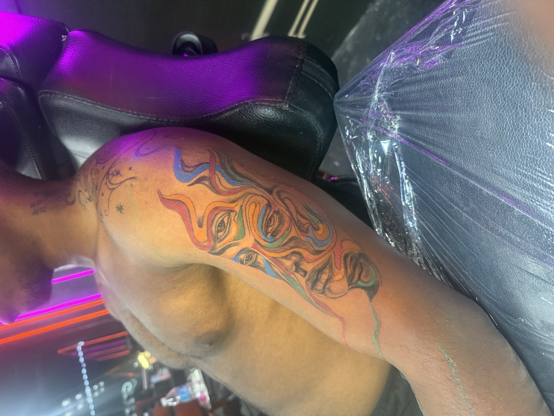 Abstract + Color face tattoo on Upper Arm by AmenInkLLC on TattMe