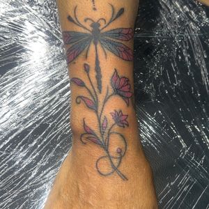 Floral + Color dragonfly tattoo on Wrist by Mo_Money_Tatts on TattMe