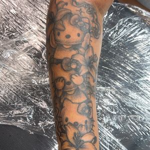 Black & Grey + Pop Culture hello kitty tattoo on Forearm by Mo_Money_Tatts on TattMe