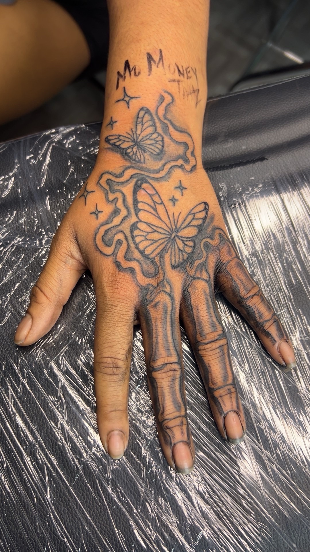 Black & Grey + Line-work butterflies tattoo on Hand by Mo_Money_Tatts on TattMe