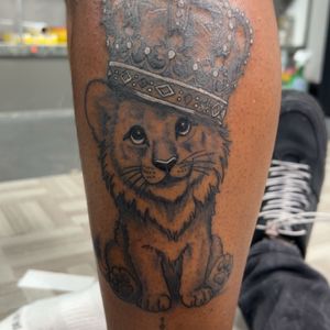 Black & Grey + Illustrative lion cub tattoo on Calf by Mo_Money_Tatts on TattMe