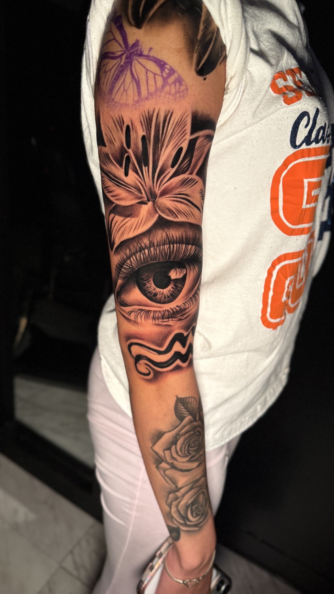 Black & Grey + Photo Realism Lily flower tattoo on Upper Arm by Kevin_Gray on TattMe