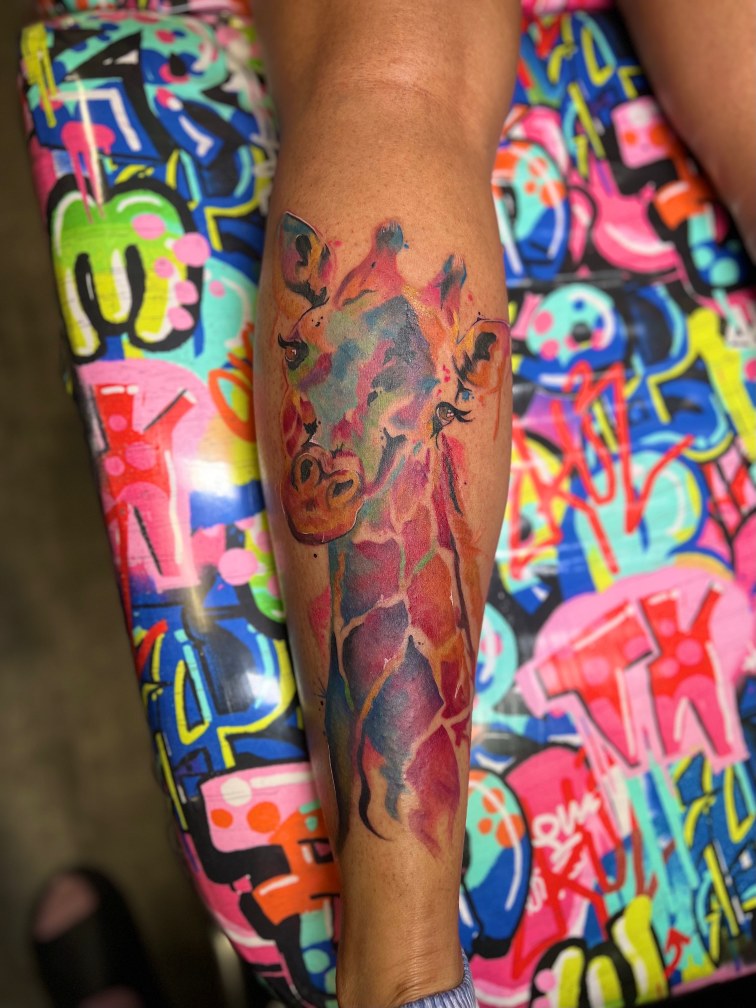 Watercolor + Animals giraffe tattoo on Calf by Marvelous_Millzy on TattMe