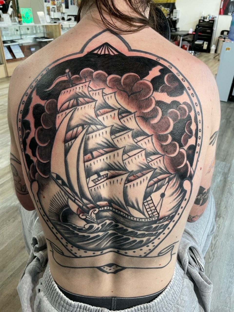 Black & Grey + American Traditional ship tattoo by all_saints_social on TattMe