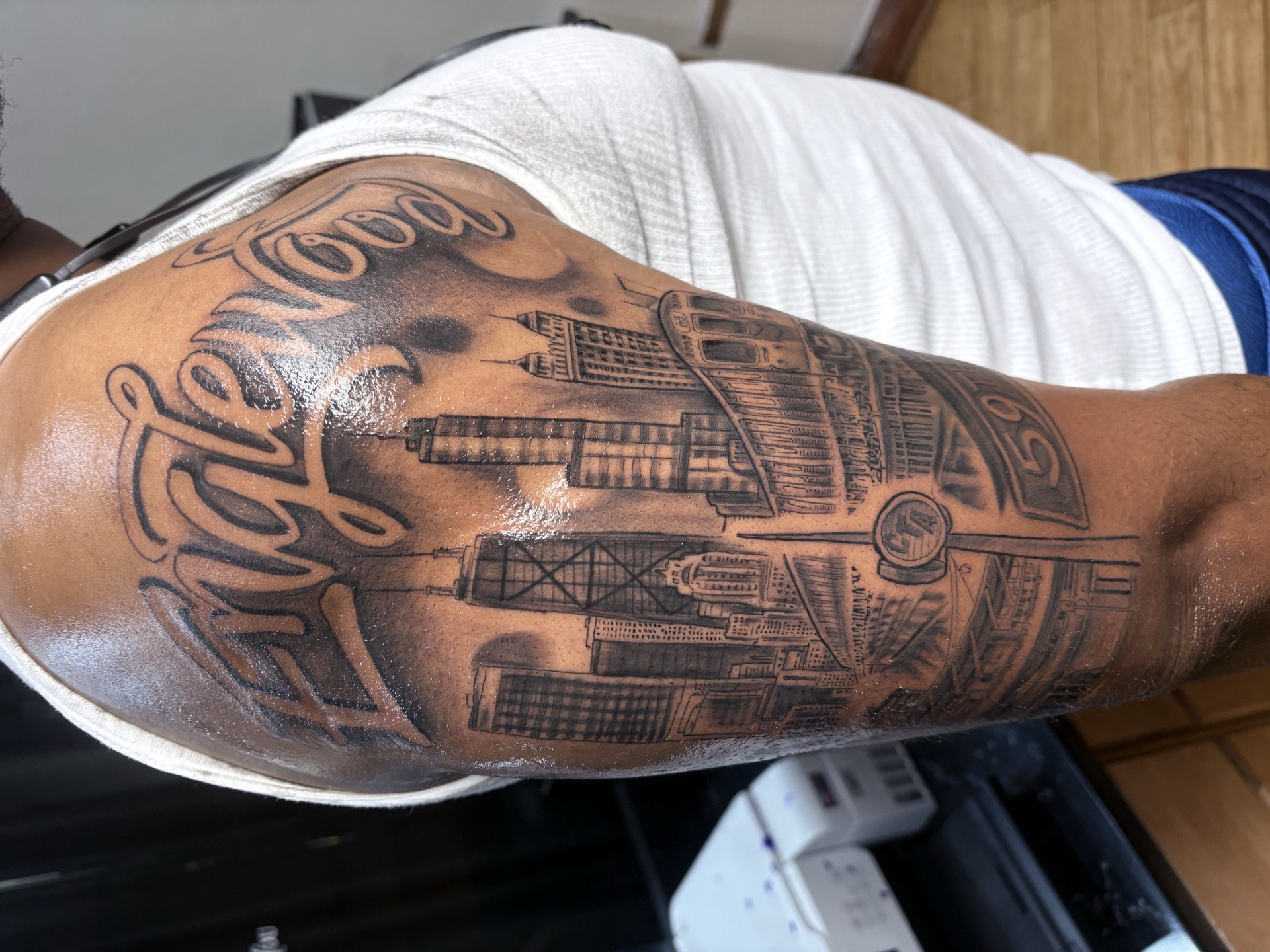 Black & Grey + Lettering cityscape tattoo on Upper Arm by Vo_The_Drug on TattMe