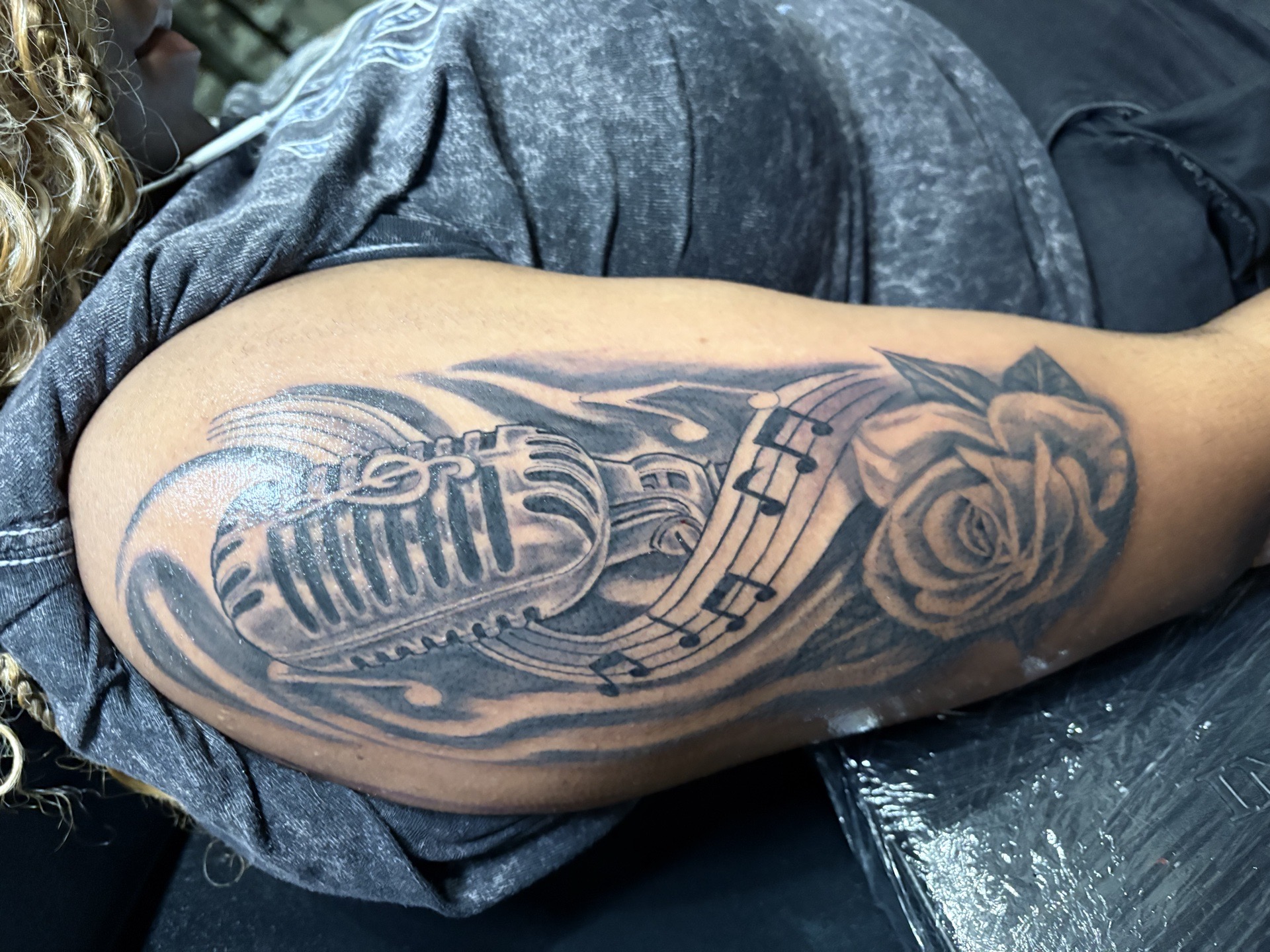 Black & Grey + Illustrative microphone tattoo on Upper Arm by Vo_The_Drug on TattMe