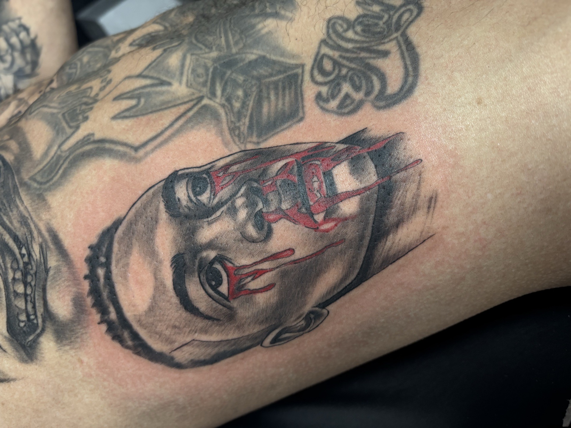 Black & Grey + Horror face tattoo on Upper Arm by Redtats on TattMe