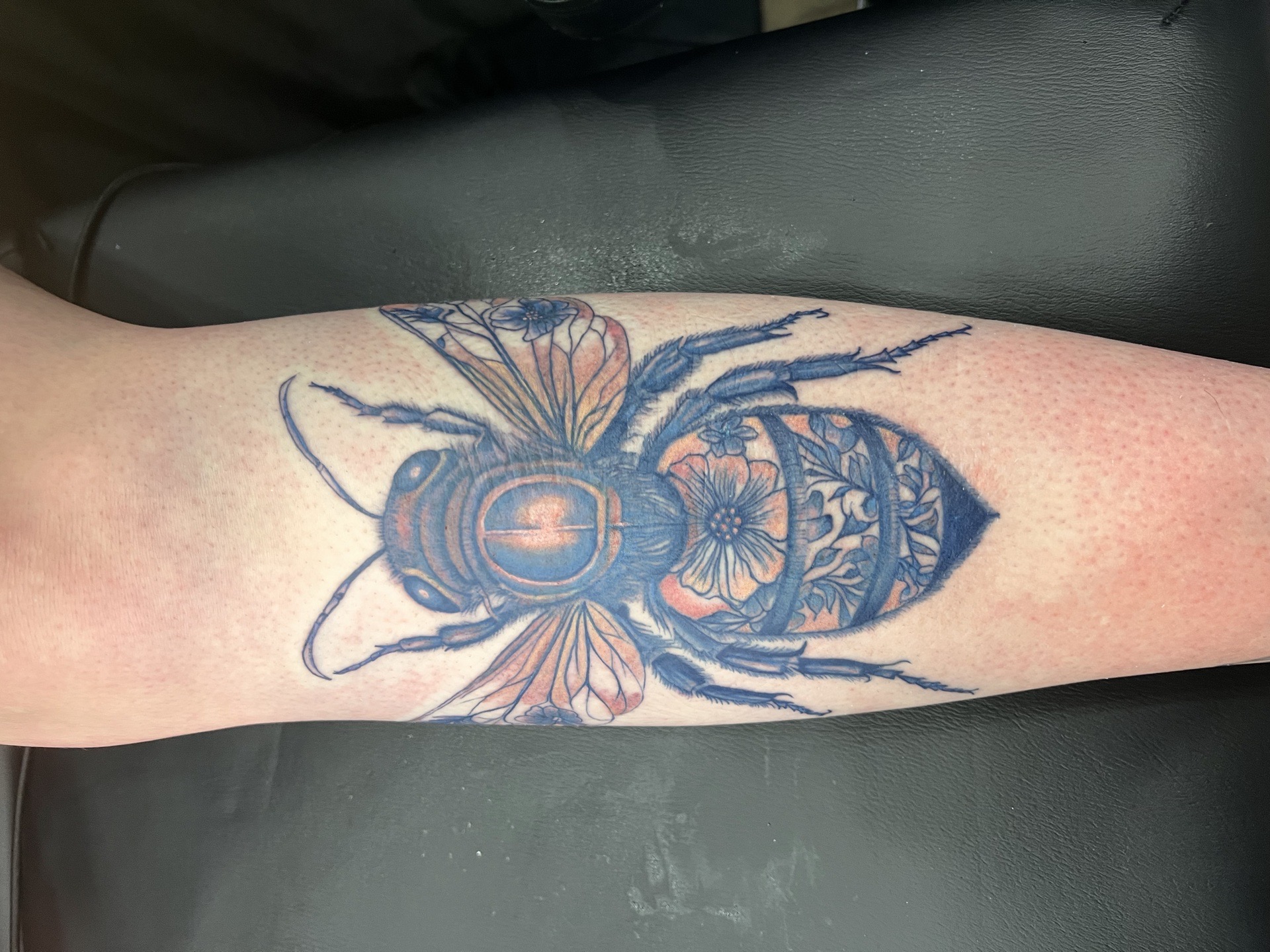 Illustrative + Floral bee tattoo on Calf by Kiwi on TattMe