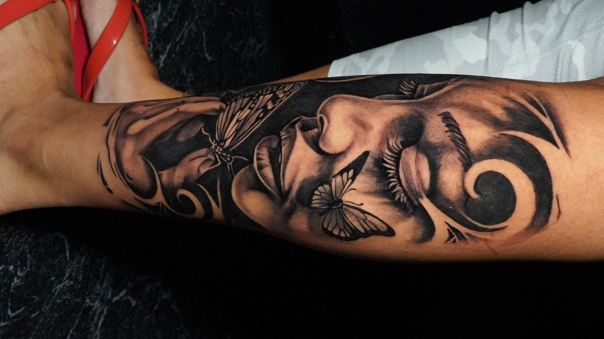Surrealism + Black & Grey face tattoo on Calf by TATMANERC on TattMe