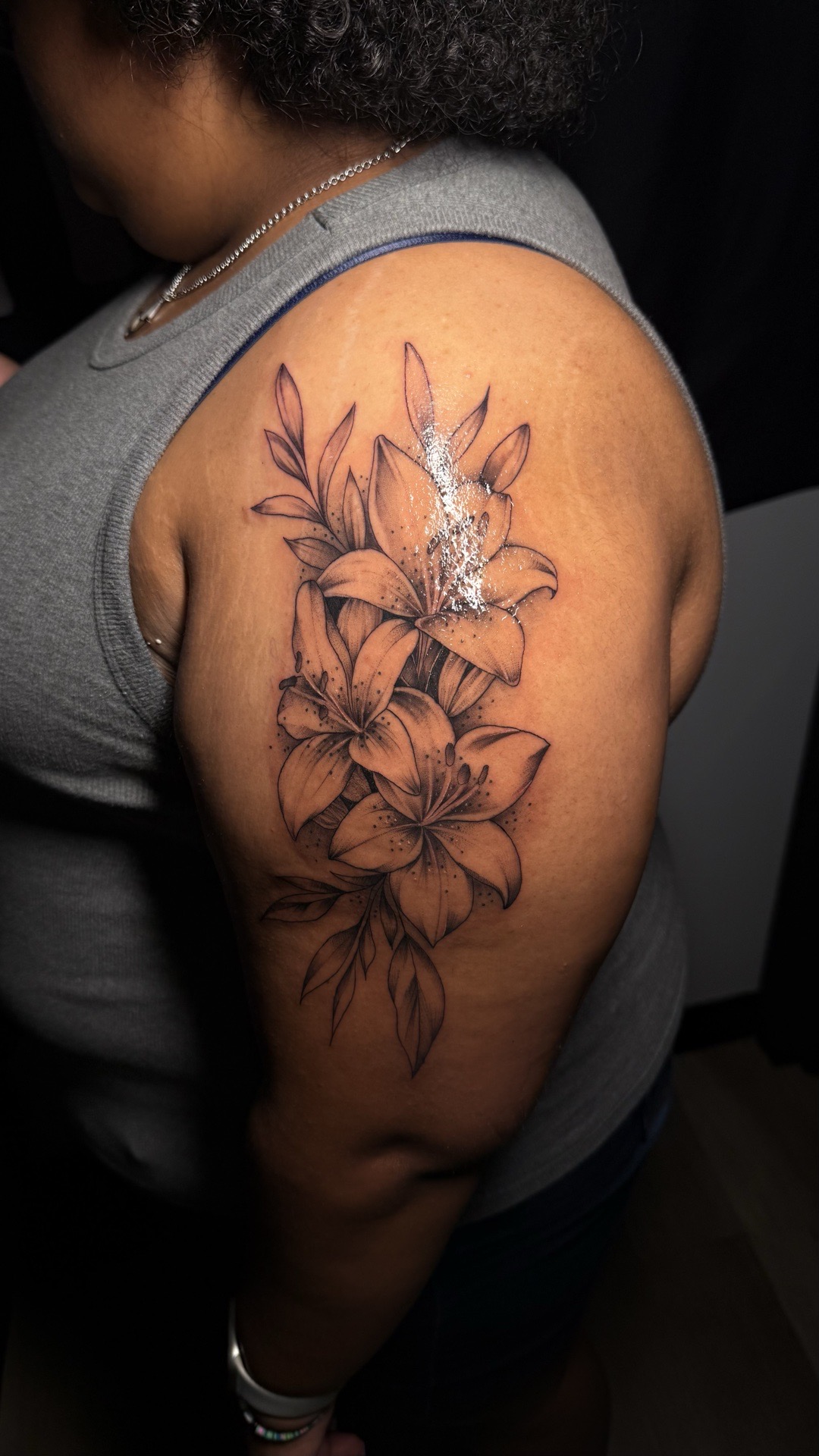 Floral + Fine Line flowers tattoo on Upper Arm by tattoo.banditt on TattMe