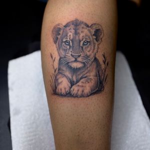 Black & Grey + Realism lion tattoo on Calf by 100inkz on TattMe