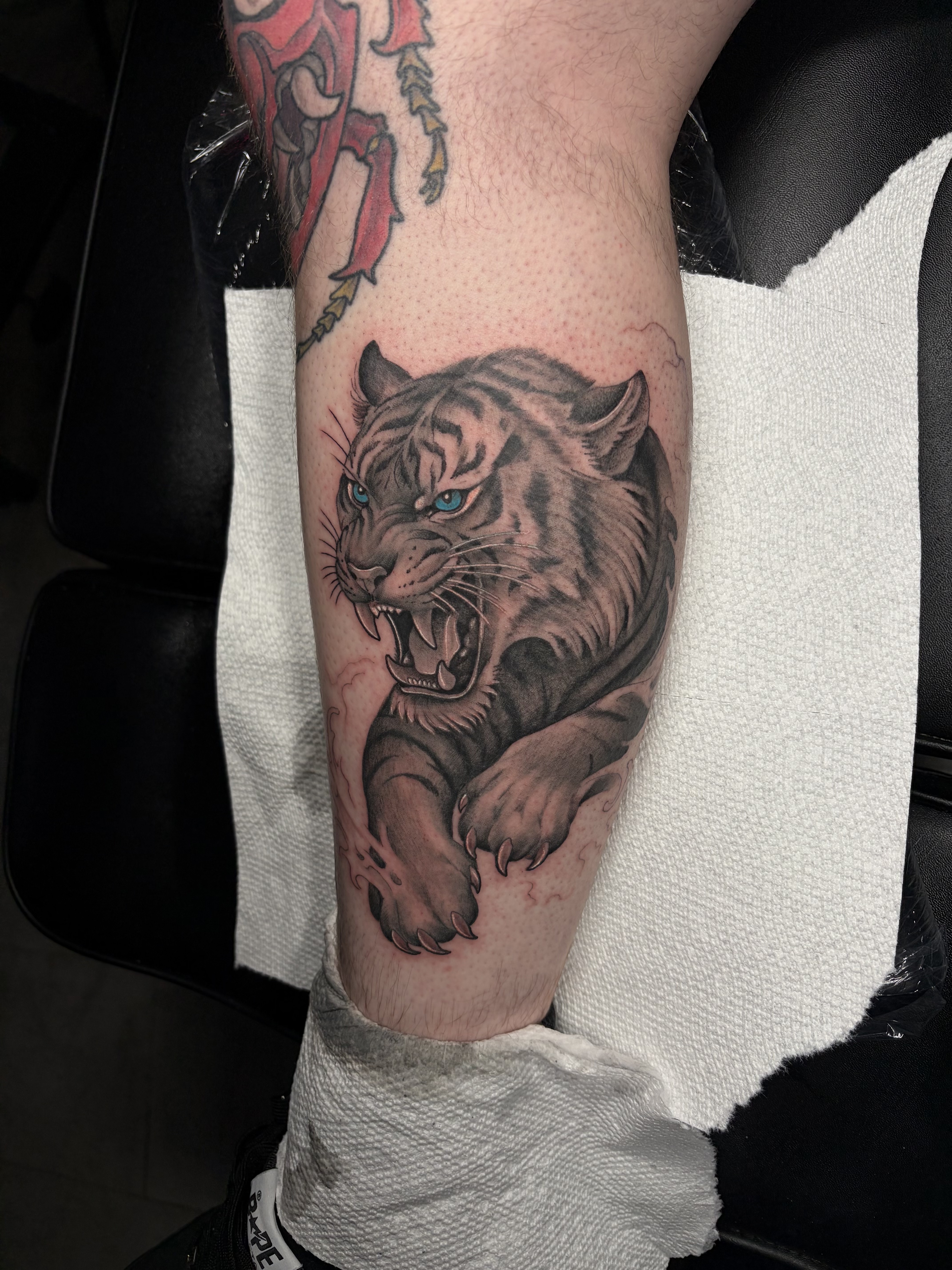 Black & Grey + Realism tiger tattoo on Calf by 100inkz on TattMe