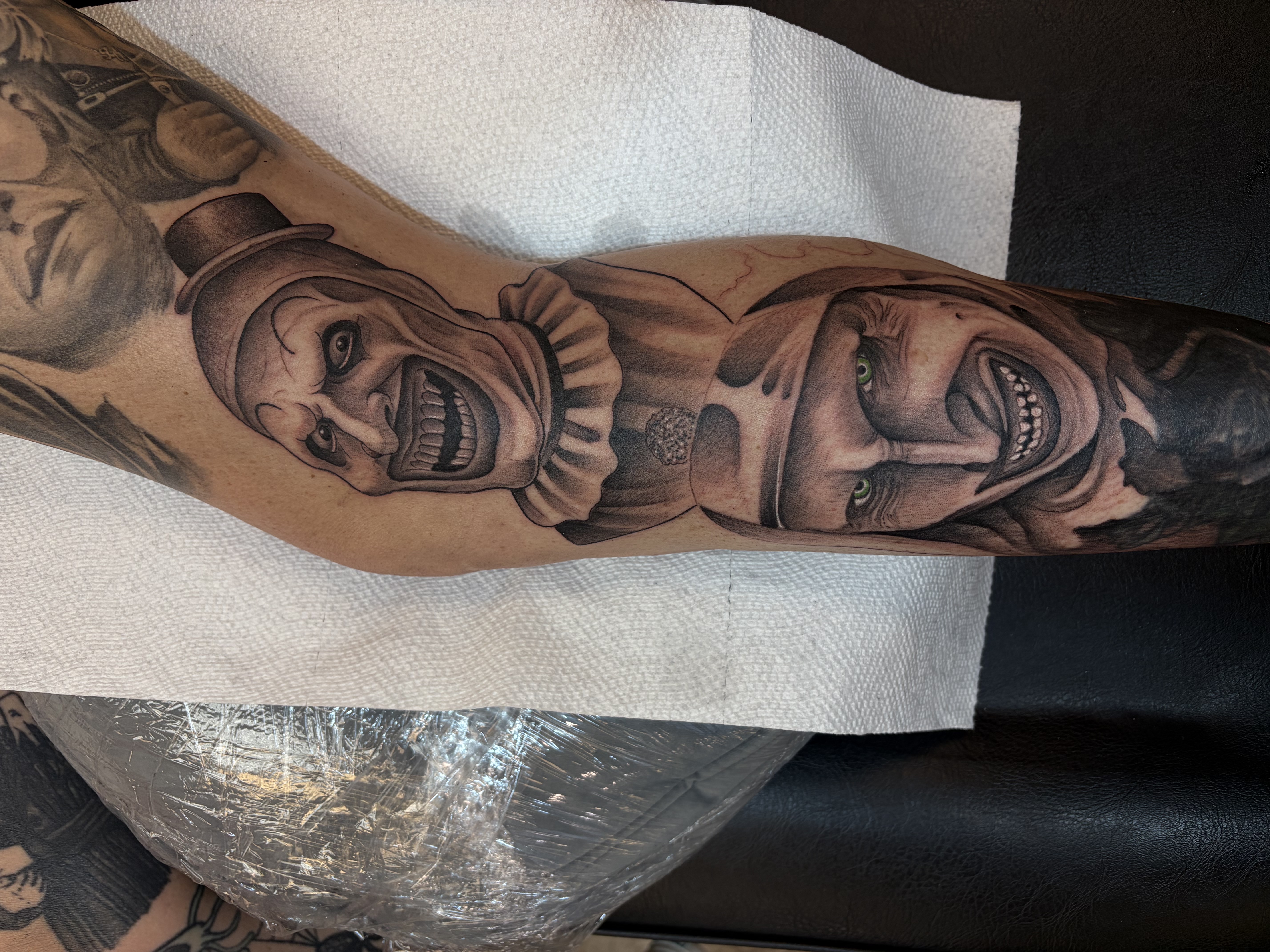 Black & Grey + Realism clowns tattoo on Calf by 100inkz on TattMe