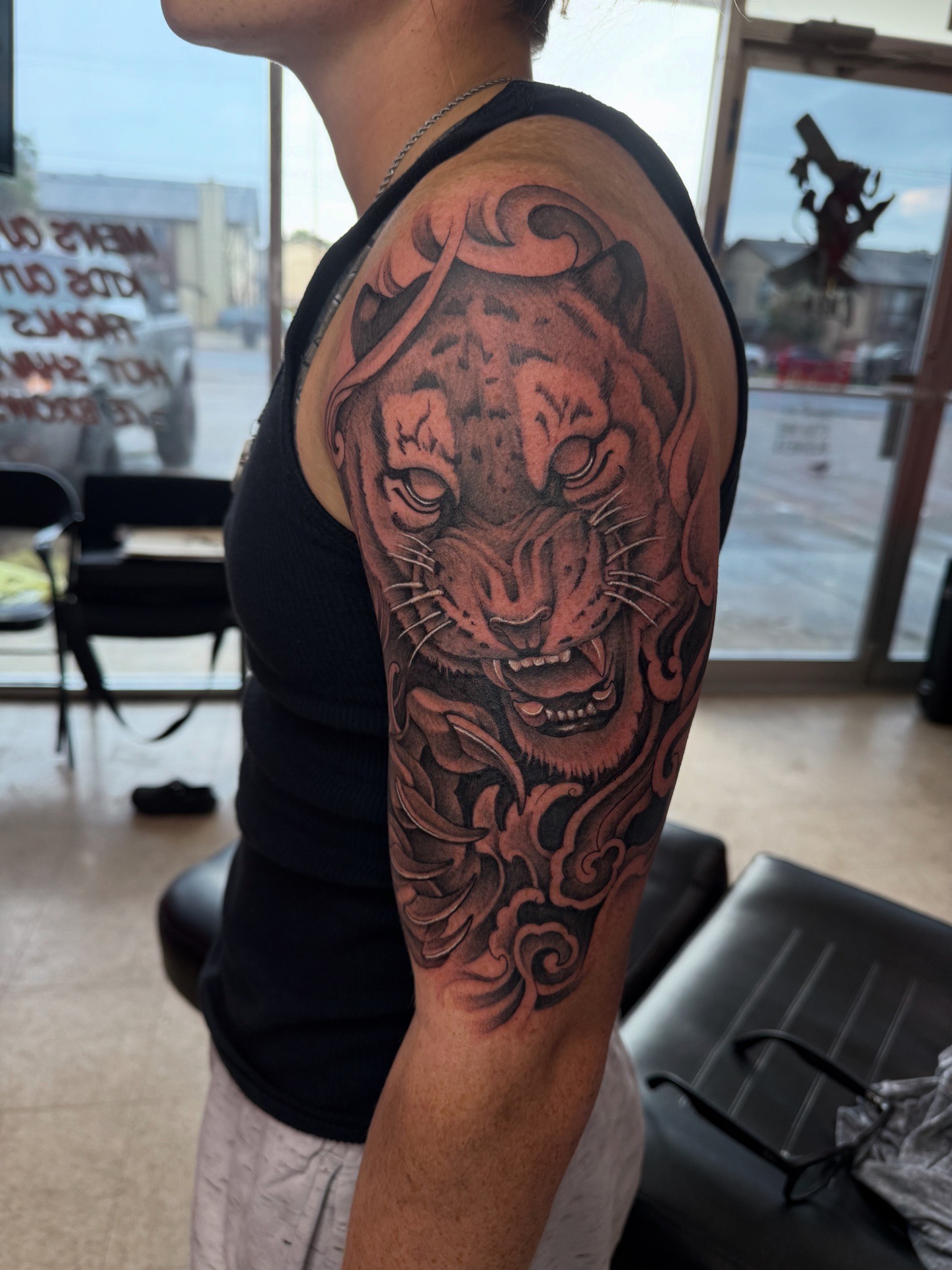 Black & Grey + Illustrative tiger tattoo on Upper Arm by 100inkz on TattMe