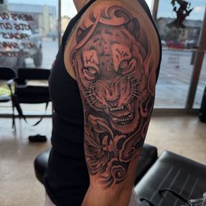 Black & Grey + Illustrative tiger tattoo on Upper Arm by 100inkz on TattMe