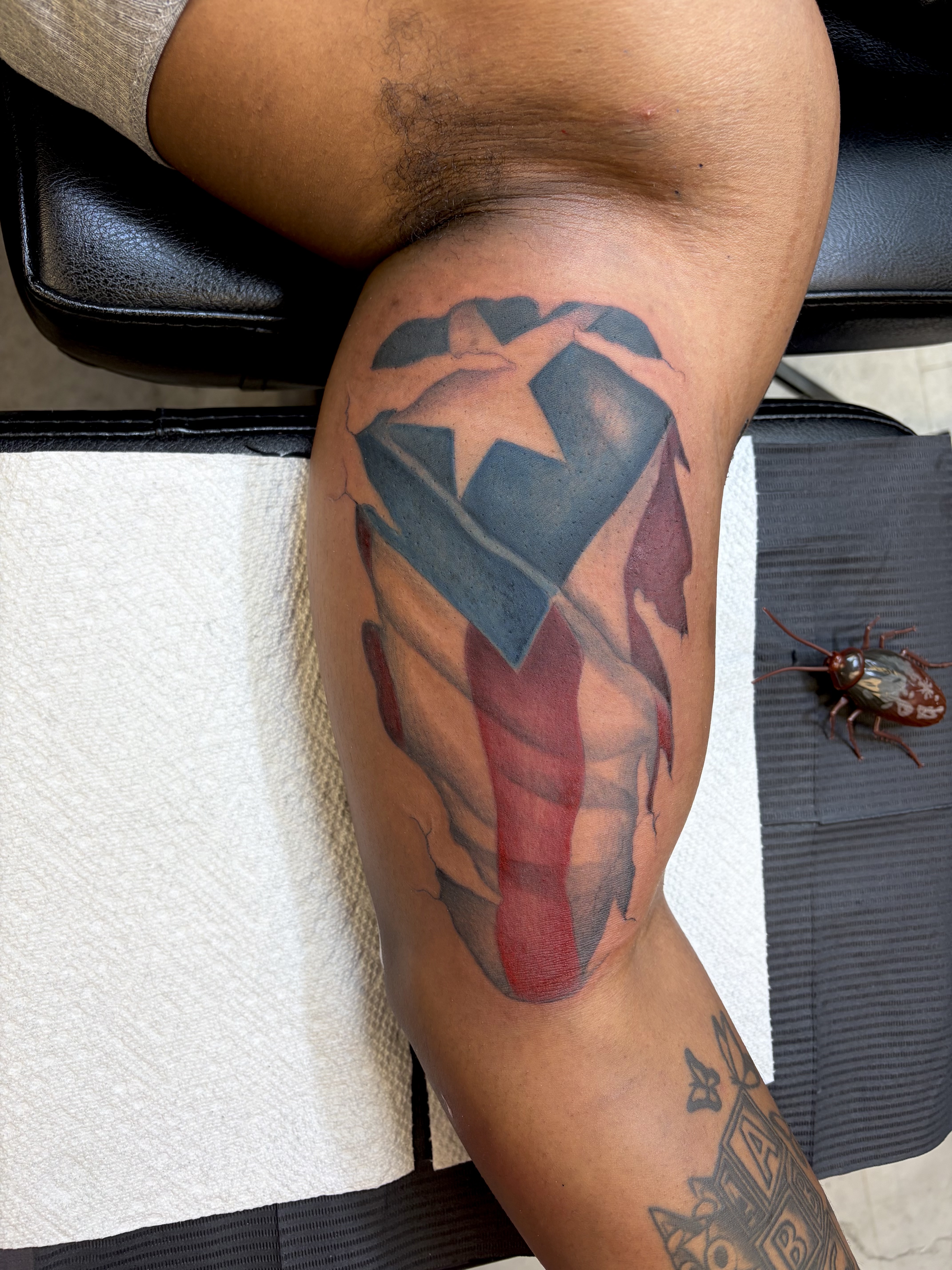 Color + Illustrative puerto rican flag tattoo on Upper Arm by 100inkz on TattMe