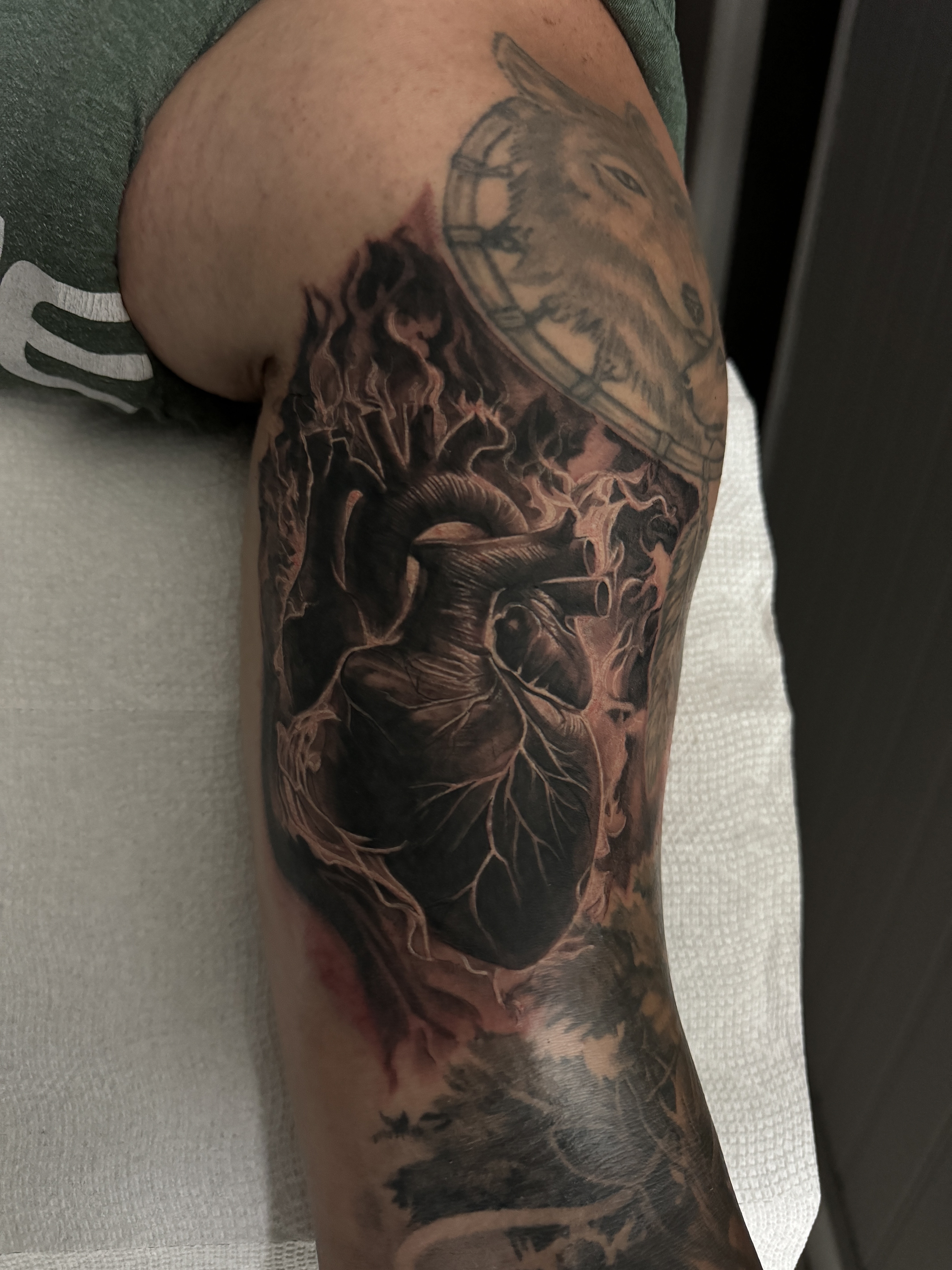 Black & Grey + Realism anatomical heart tattoo on Upper Arm by D-Artist on TattMe