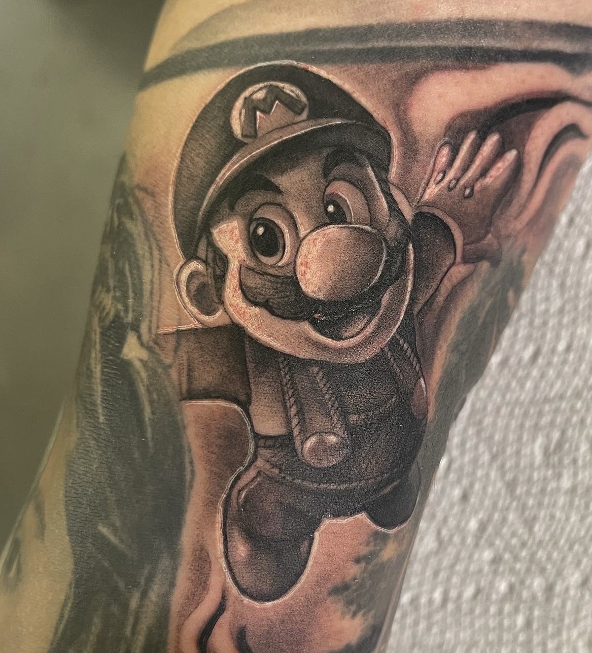 Black & Grey + Pop Culture mario tattoo on Upper Arm by D-Artist on TattMe