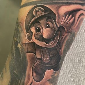 Black & Grey + Pop Culture mario tattoo on Upper Arm by D-Artist on TattMe