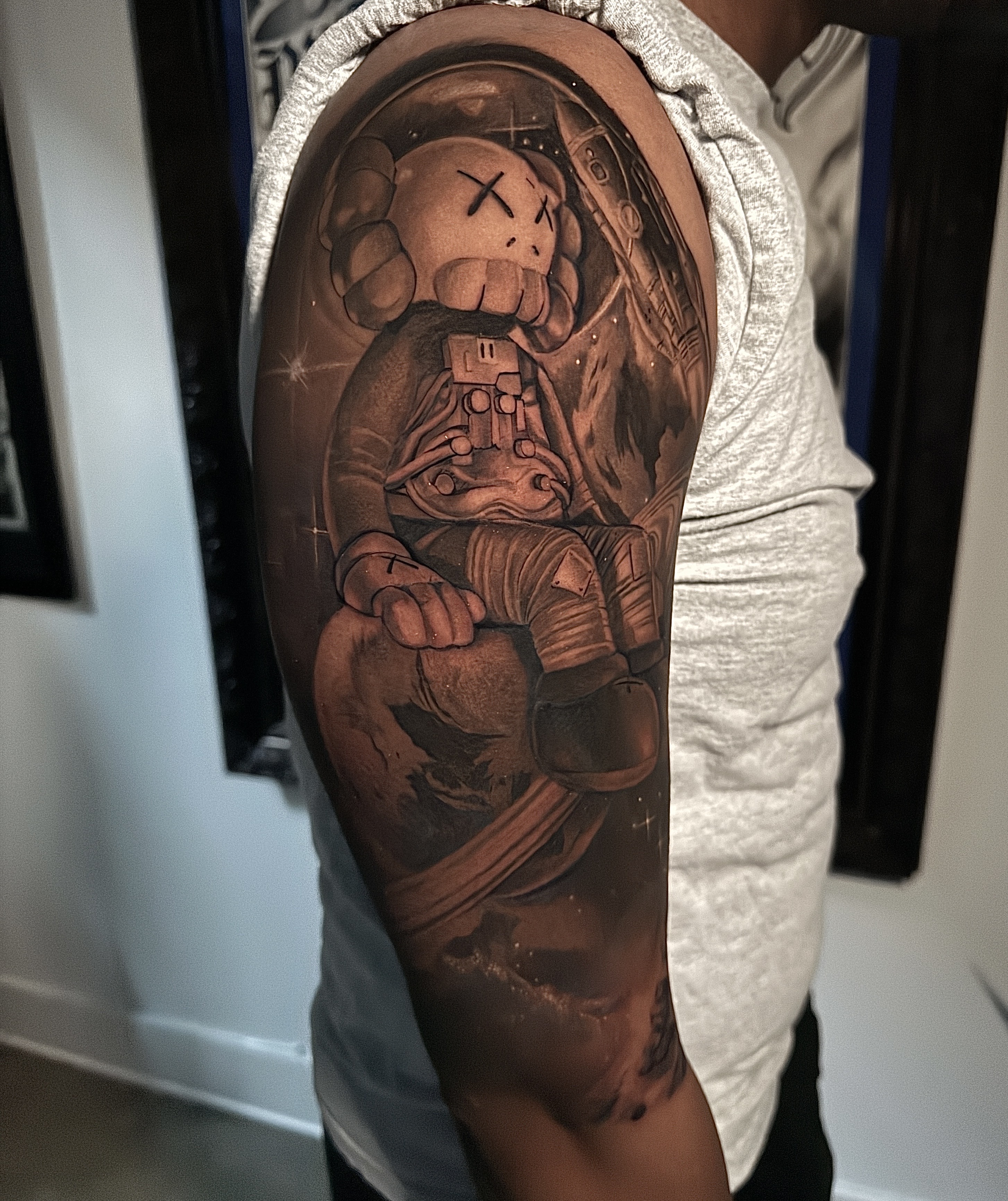 Black & Grey + Pop Culture astronaut tattoo on Upper Arm by D-Artist on TattMe