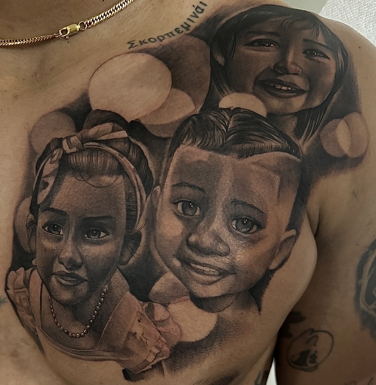 Realism + Black & Grey children tattoo on Chest by D-Artist on TattMe