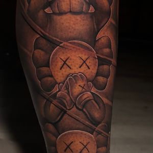 Pop Culture + Black & Grey kaws tattoo on Calf by D-Artist on TattMe