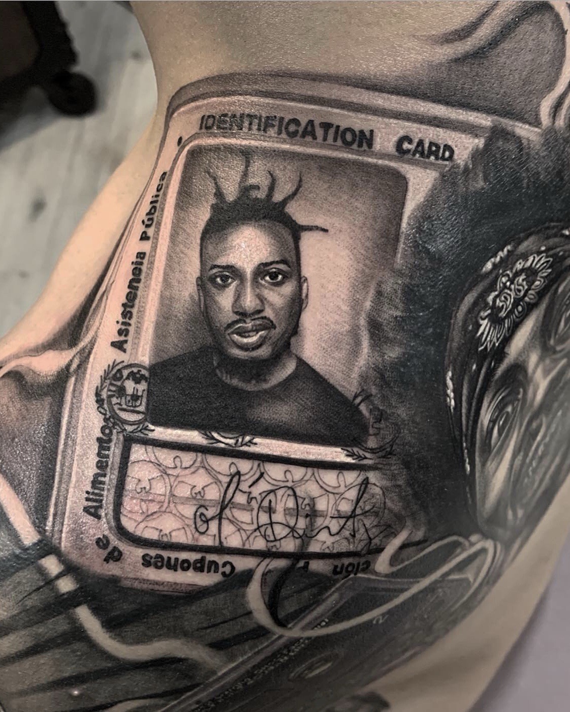 Realism + Black & Grey identification card tattoo on Shoulder by D-Artist on TattMe