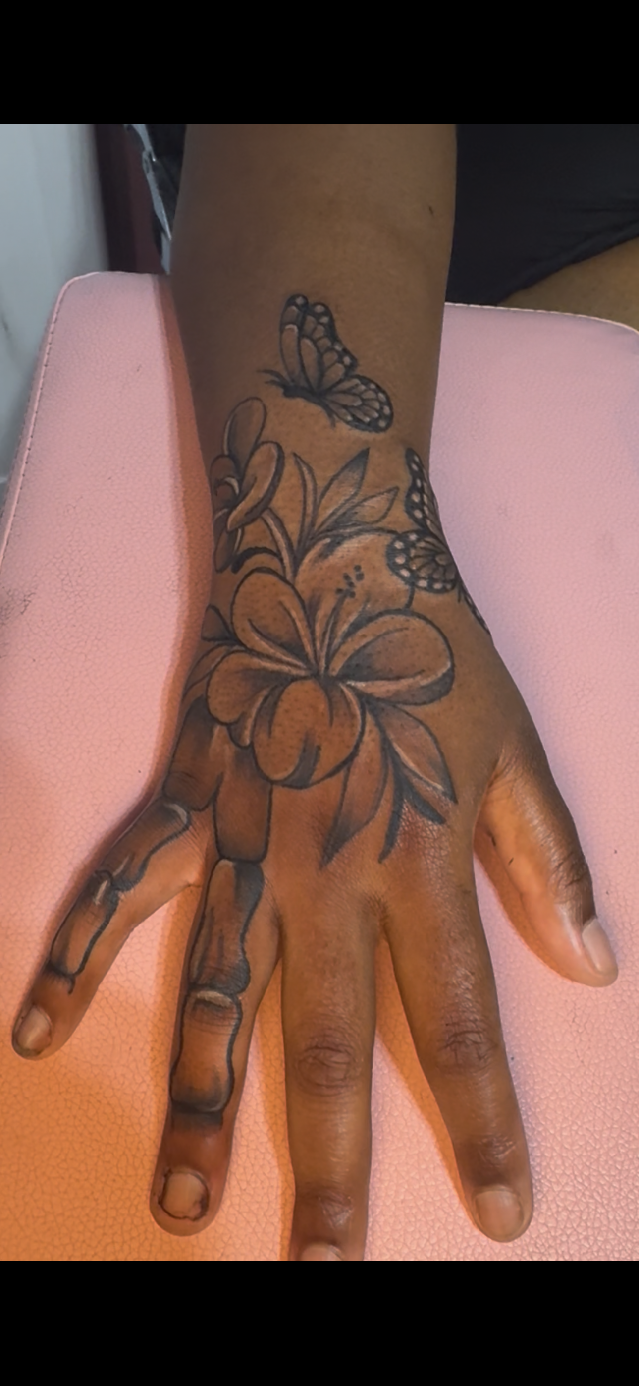 Black & Grey + Floral flowers tattoo on Hand by InkhyTatts on TattMe