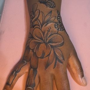Black & Grey + Floral flowers tattoo on Hand by InkhyTatts on TattMe