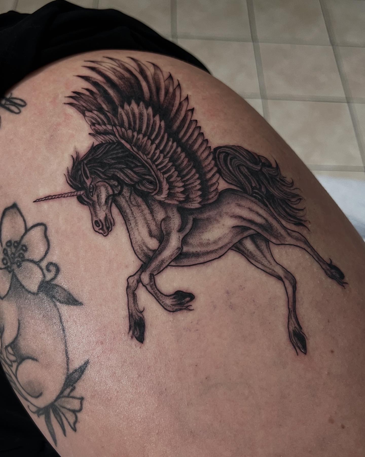 Black & Grey + Fine Line unicorn tattoo on Thigh by Q_tattoo on TattMe