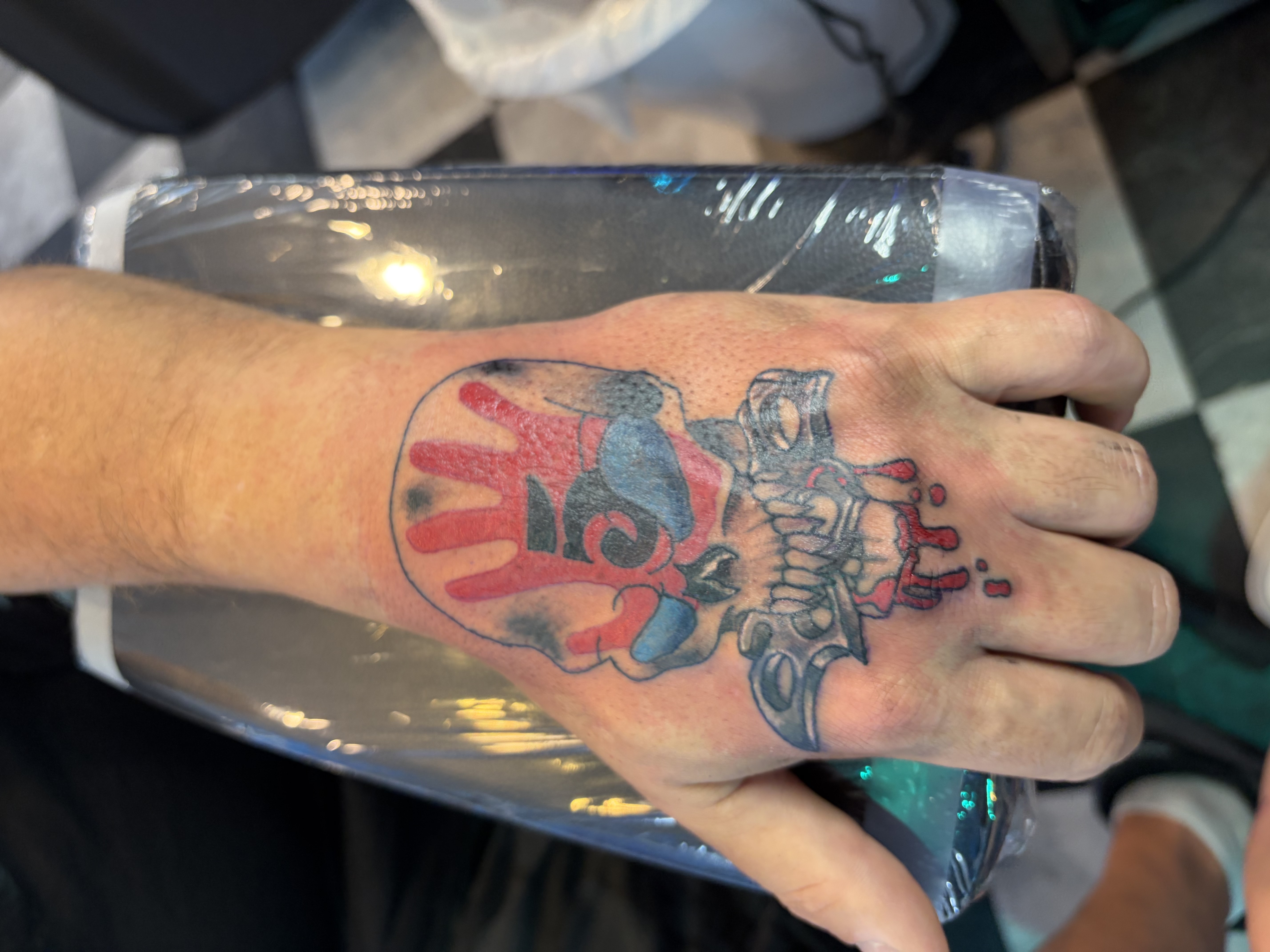 Color + Illustrative skull tattoo on Hand by Meaney_Tattoos_06 on TattMe