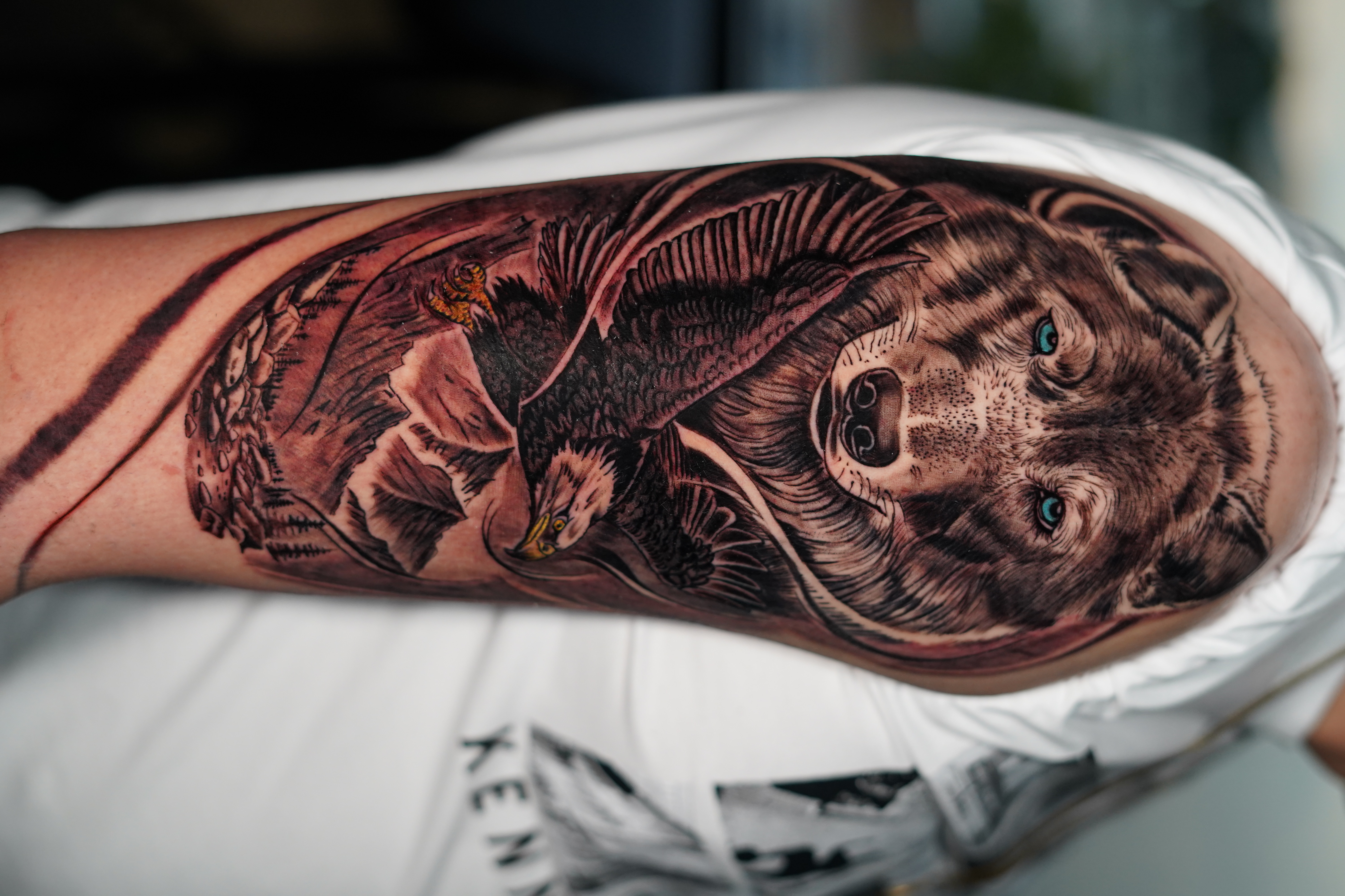 Realism + Black & Grey wolf tattoo on Upper Arm by victorm.tattoo on TattMe