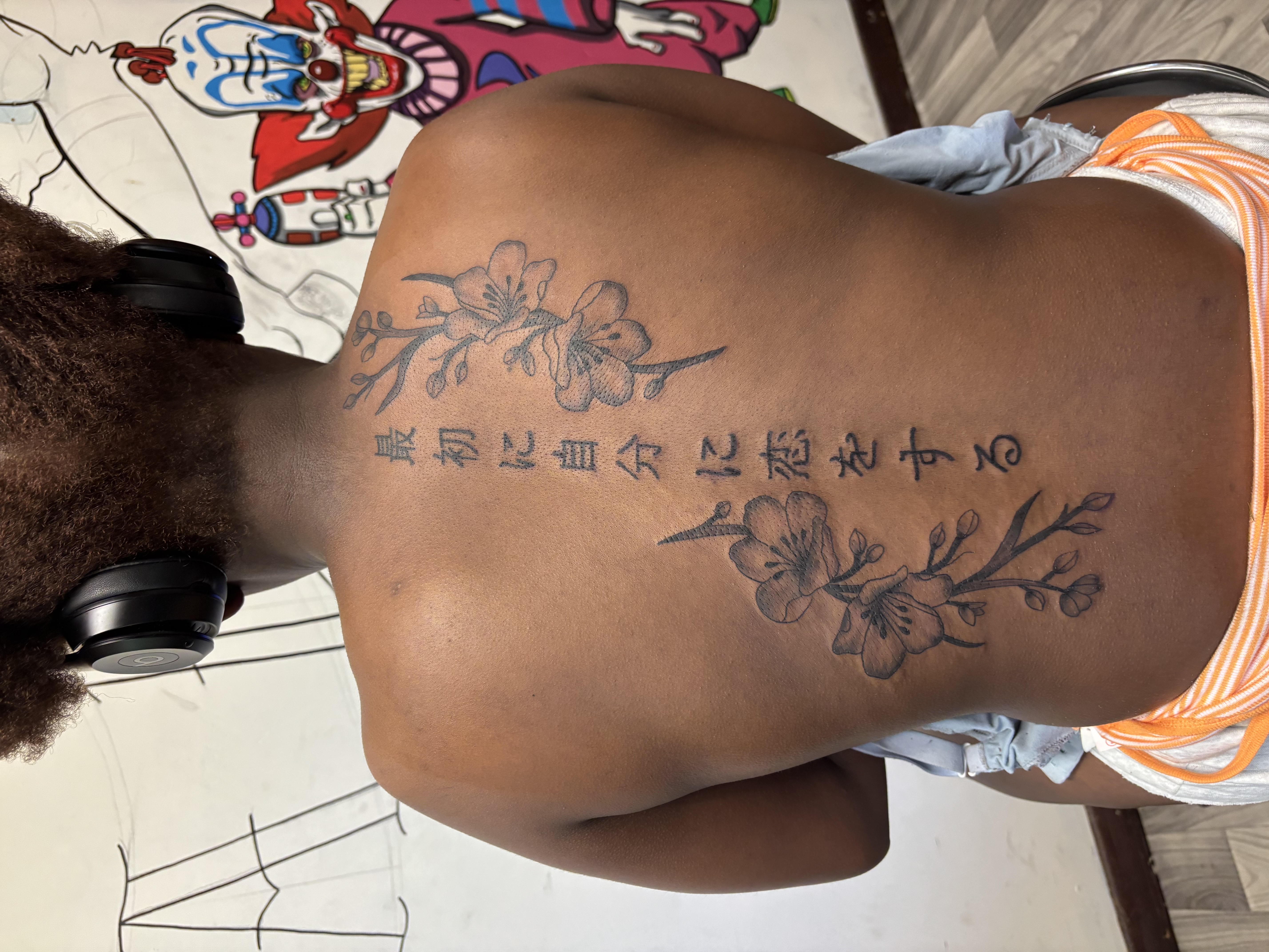Floral + Fine Line flowers tattoo on Upper Back by TatsByDaVinci on TattMe