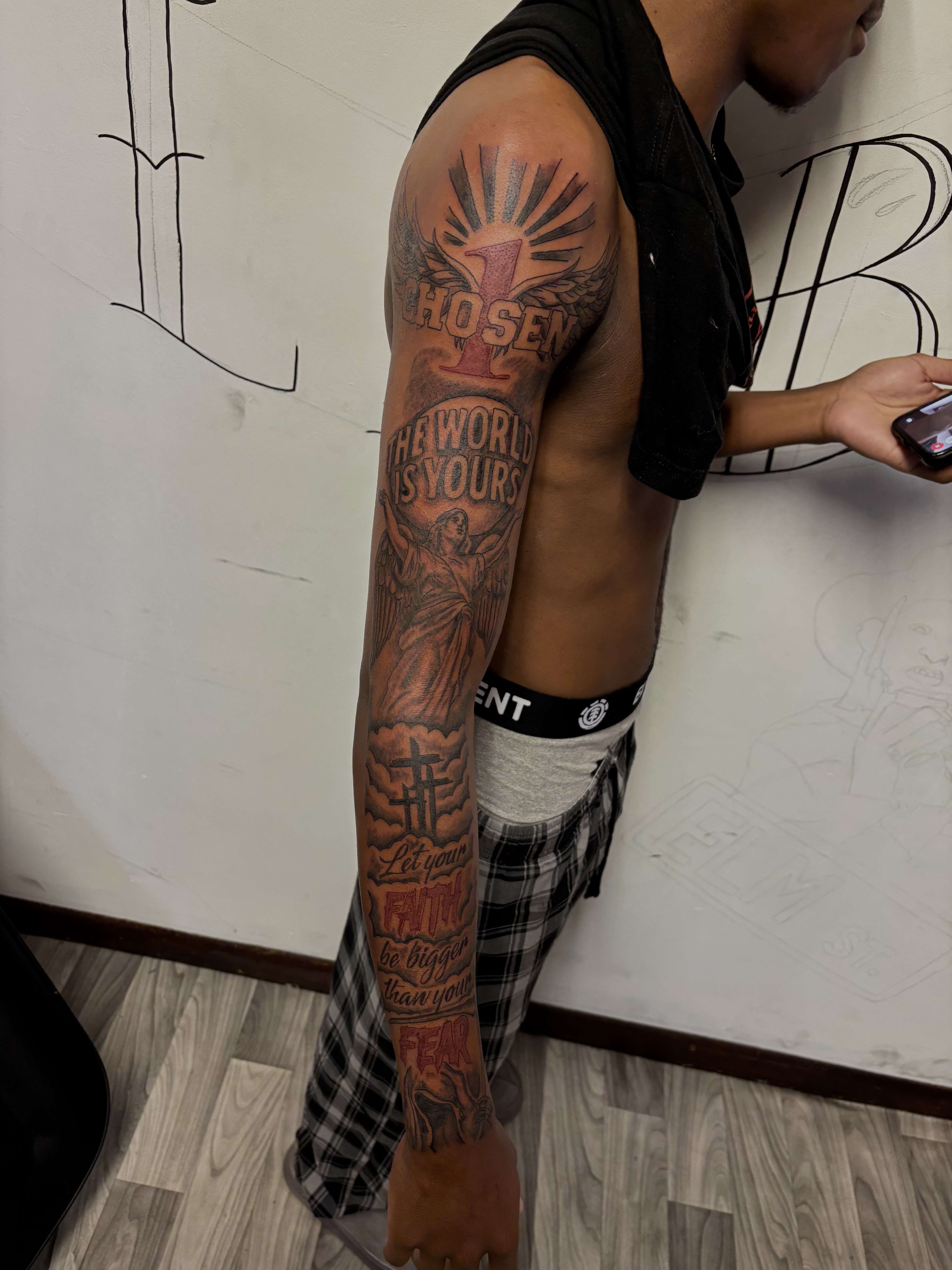 Lettering + Illustrative wings tattoo on Full Sleeve by TatsByDaVinci on TattMe